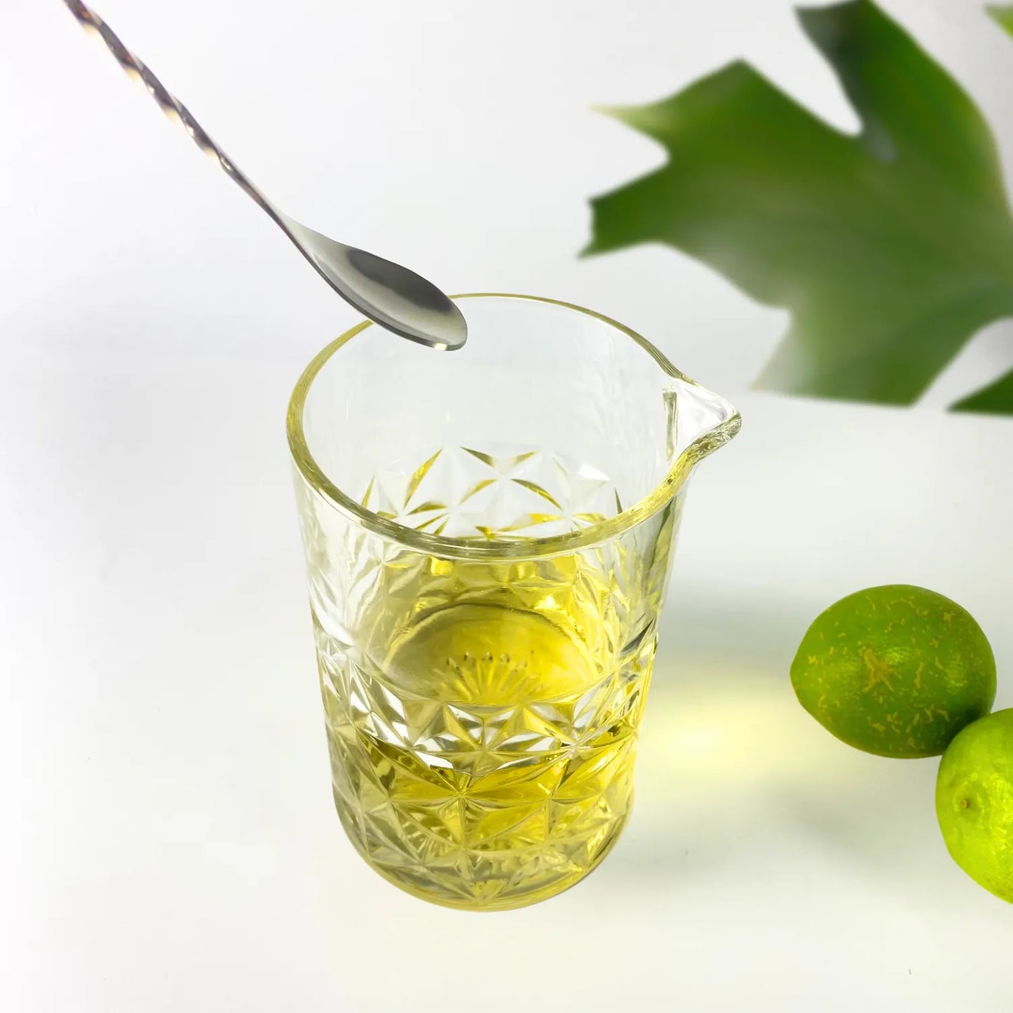 cocktail mixing glass in use
