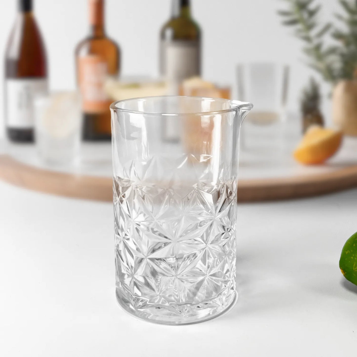 cocktail mixing glass on table