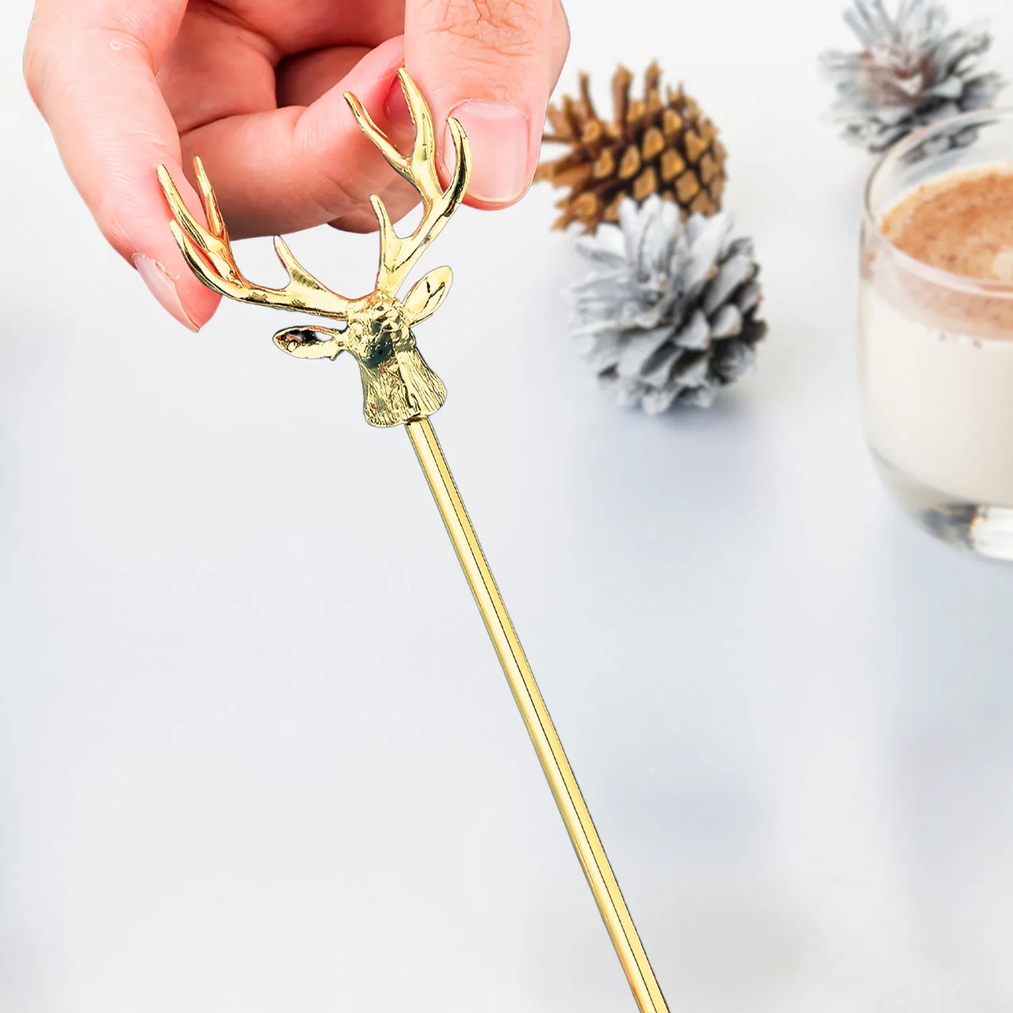gold deer swizzle stick detail