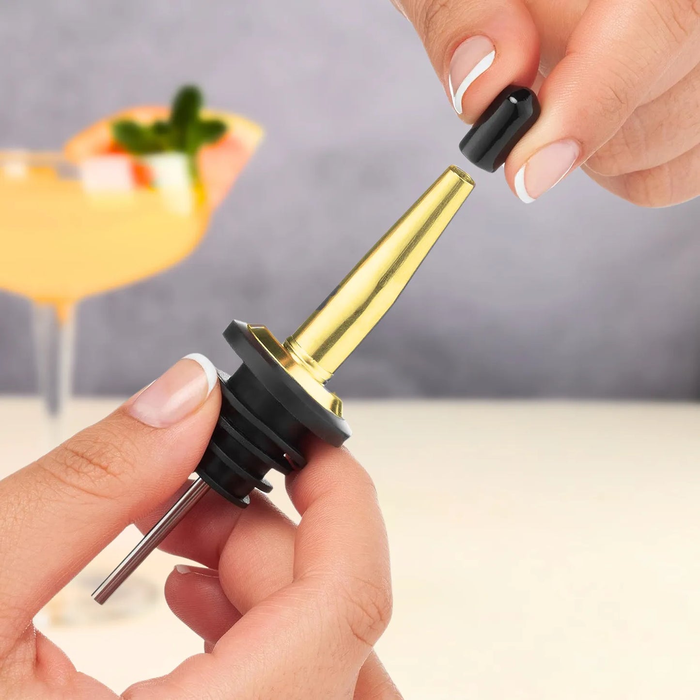 gold pourer with cap