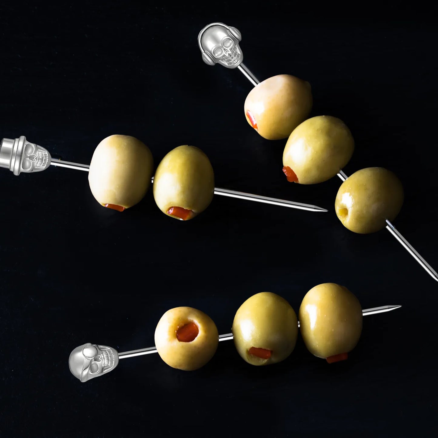 skull cocktail picks in use